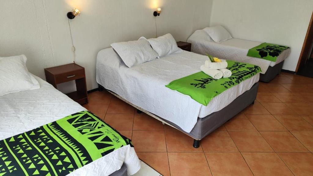 Postel nebo postele na pokoji v ubytování Hotel Hotu Matua by EI