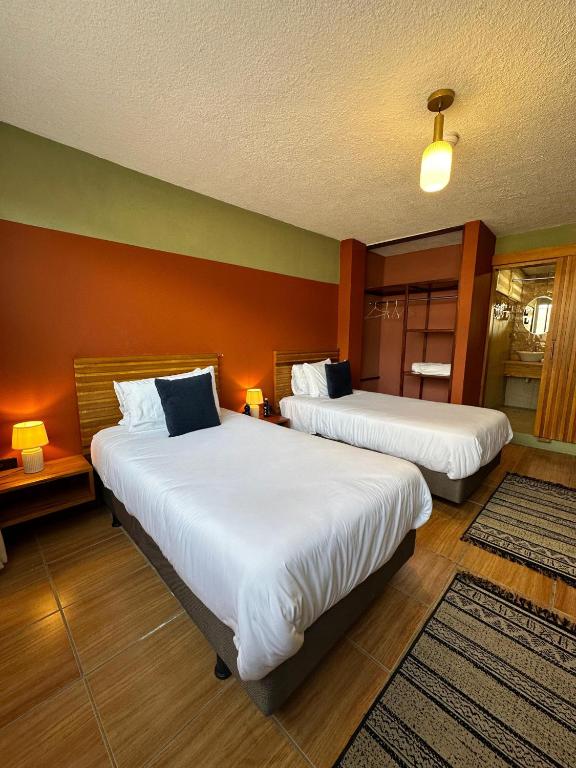 Postel nebo postele na pokoji v ubytování Hotel Agave Baños