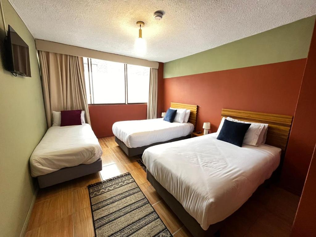 Postel nebo postele na pokoji v ubytování Hotel Agave Baños