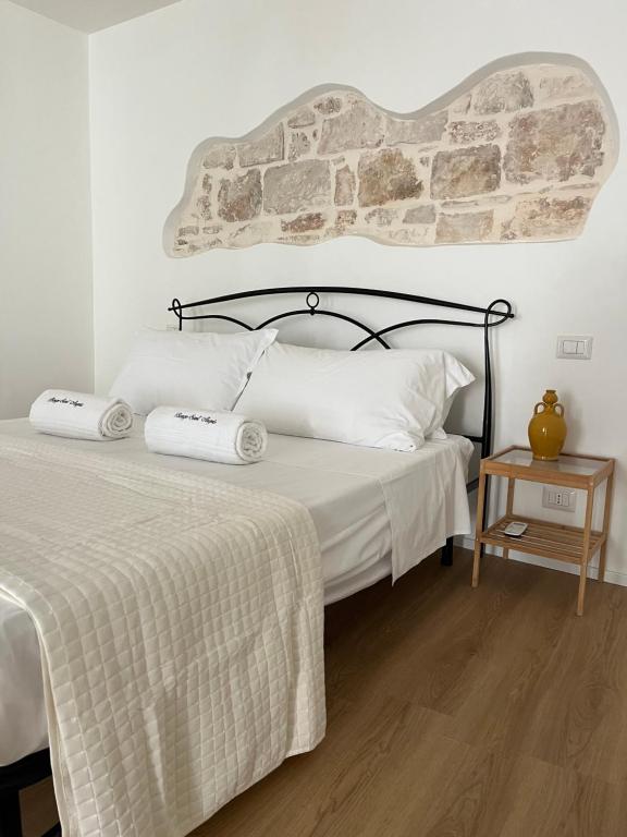 Postel nebo postele na pokoji v ubytování Borgo Sant Angelo
