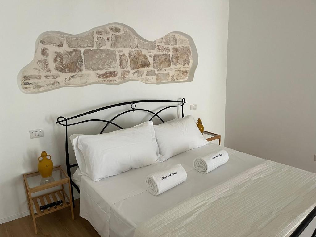 Postel nebo postele na pokoji v ubytování Borgo Sant Angelo