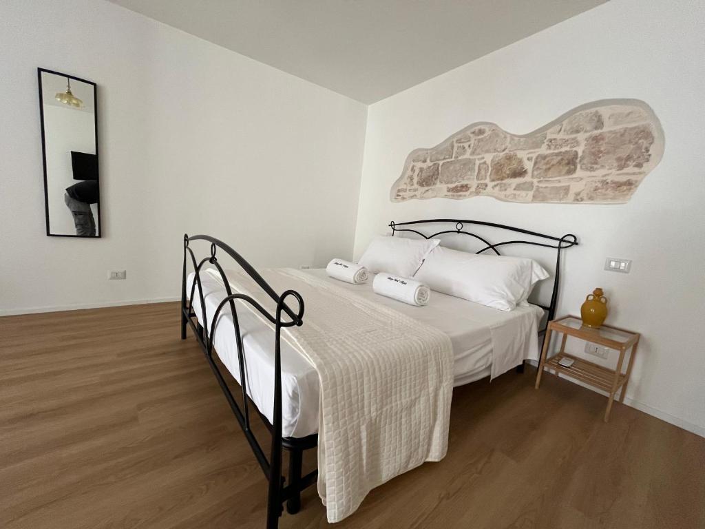 Postel nebo postele na pokoji v ubytování Borgo Sant Angelo