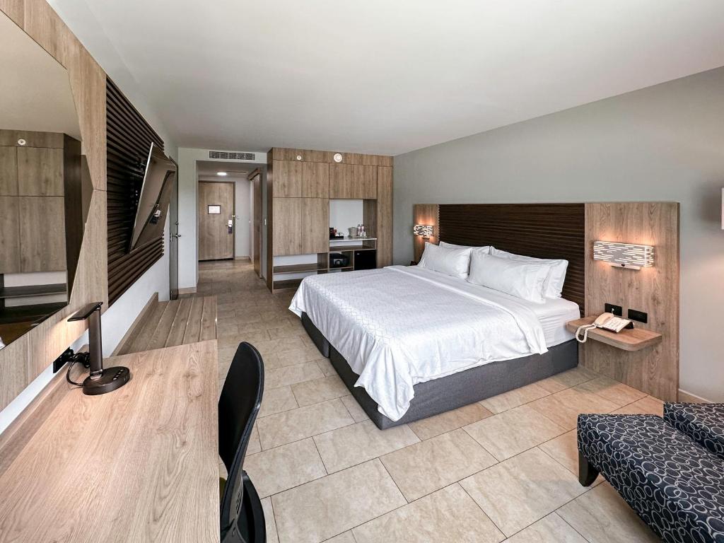 Postel nebo postele na pokoji v ubytování Holiday Inn Express Mérida by IHG