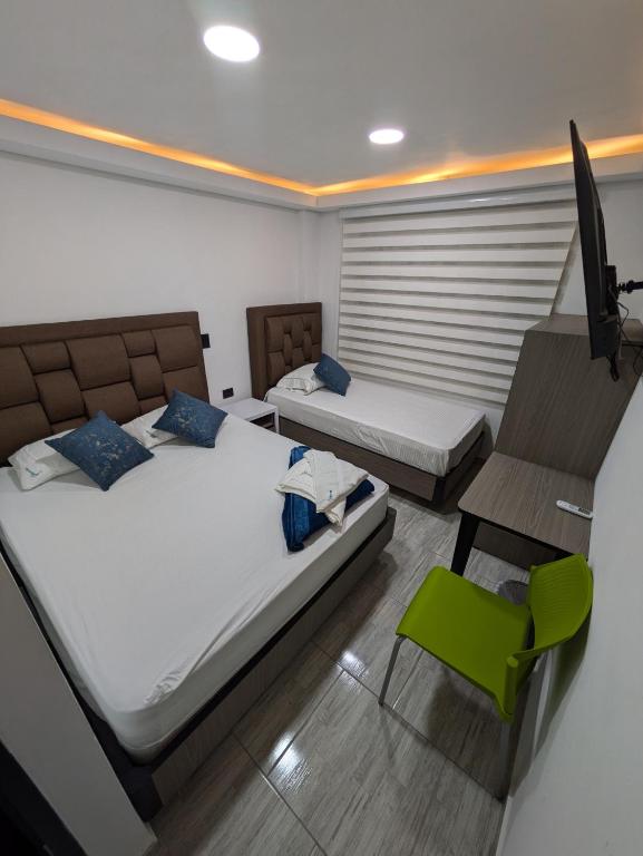 Postel nebo postele na pokoji v ubytování Hostel Boutique Nido de Loros