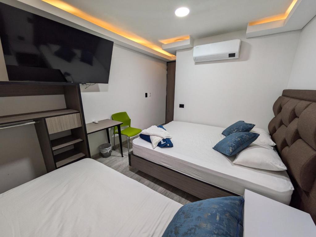 Postel nebo postele na pokoji v ubytování Hostel Boutique Nido de Loros