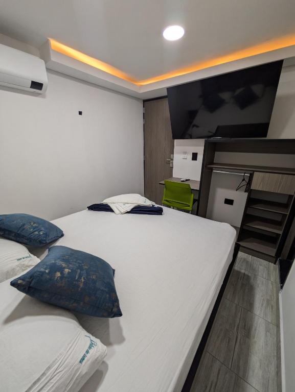 Postel nebo postele na pokoji v ubytování Hostel Boutique Nido de Loros