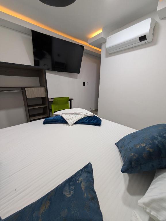 Postel nebo postele na pokoji v ubytování Hostel Boutique Nido de Loros