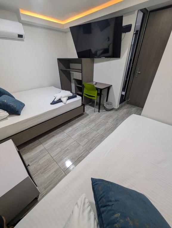 Postel nebo postele na pokoji v ubytování Hostel Boutique Nido de Loros