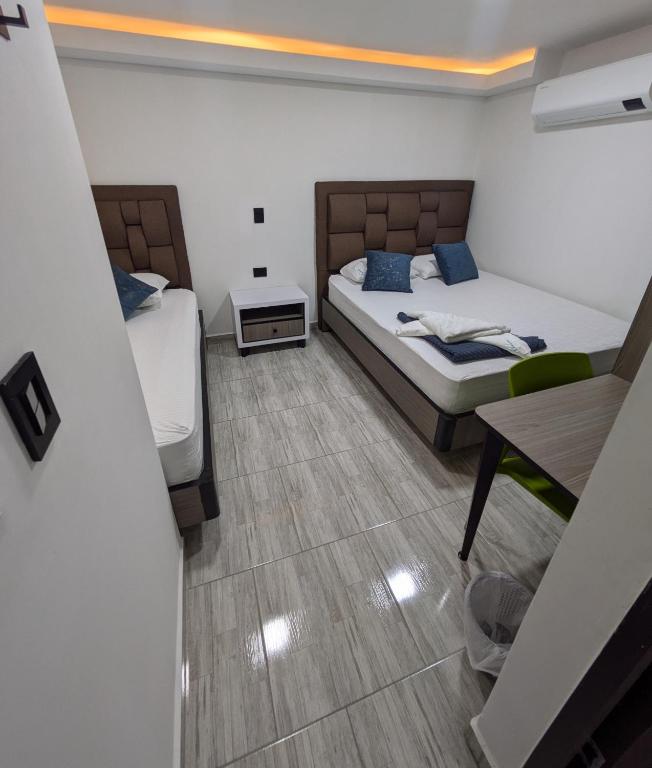 Postel nebo postele na pokoji v ubytování Hostel Boutique Nido de Loros