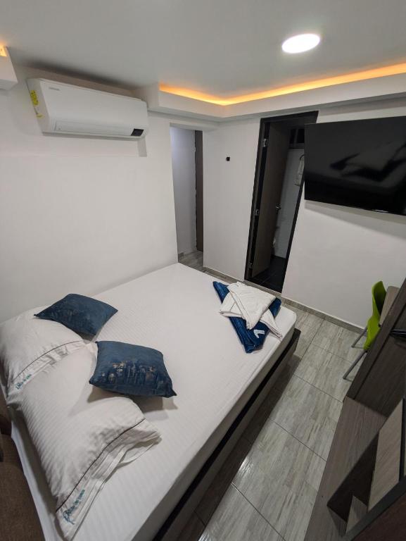 Postel nebo postele na pokoji v ubytování Hostel Boutique Nido de Loros