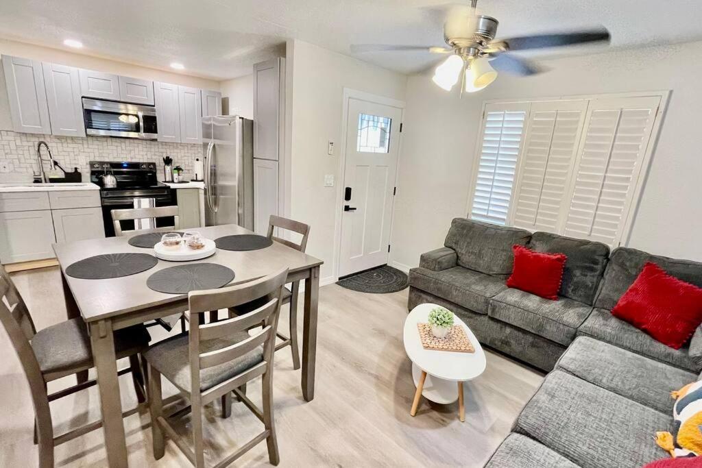 a kitchen and living room with a table and a couch at Apartment A, Restful,Cozy, close Sunland Park Mall in El Paso