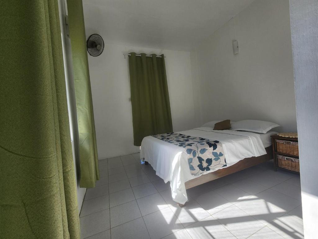 Postel nebo postele na pokoji v ubytování Kap Soley - Ile Rodrigues