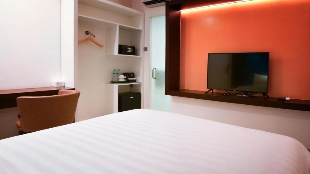 TV a/nebo společenská místnost v ubytování Grand Picasso Hotel