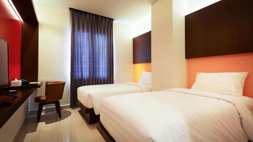 Postel nebo postele na pokoji v ubytování Grand Picasso Hotel