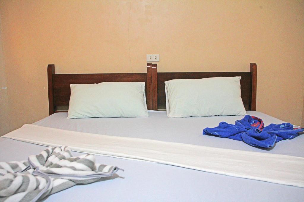 Postel nebo postele na pokoji v ubytování JBR Tourist Inn II - Port Barton