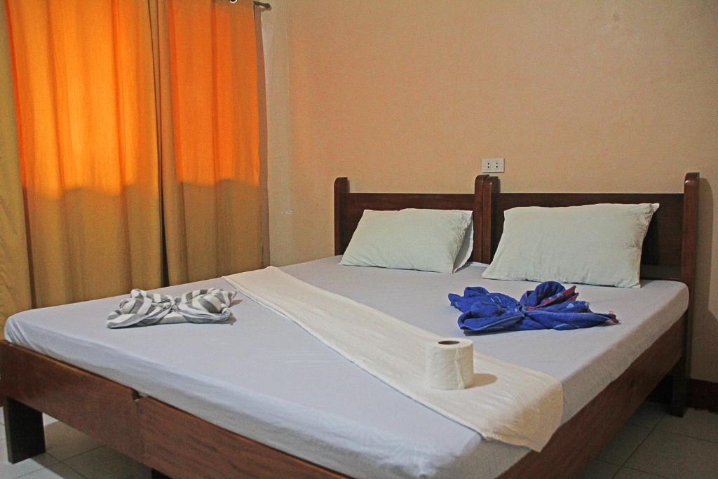 Postel nebo postele na pokoji v ubytování JBR Tourist Inn II - Port Barton