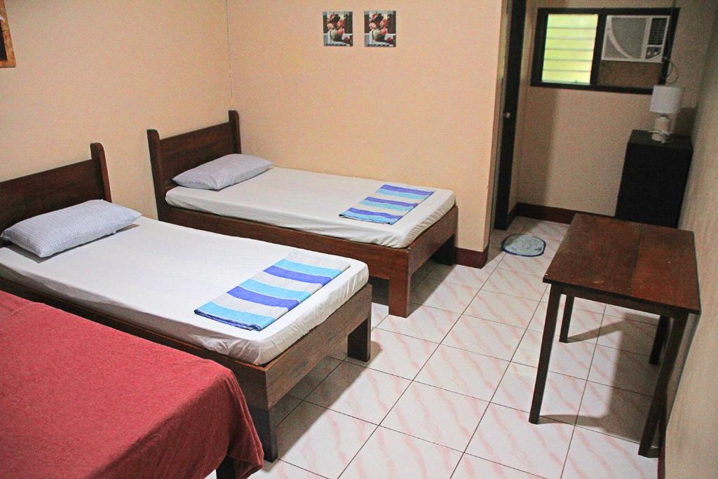 Postel nebo postele na pokoji v ubytování JBR Tourist Inn II - Port Barton