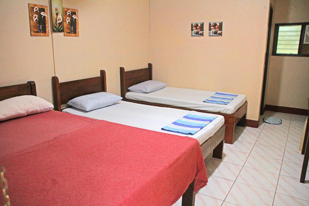 Postel nebo postele na pokoji v ubytování JBR Tourist Inn II - Port Barton