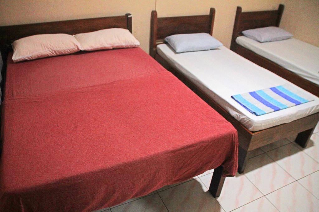 Postel nebo postele na pokoji v ubytování JBR Tourist Inn II - Port Barton