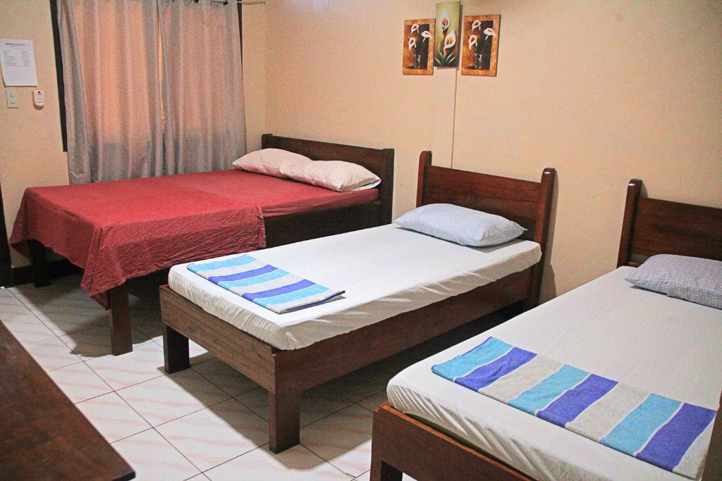 Postel nebo postele na pokoji v ubytování JBR Tourist Inn II - Port Barton