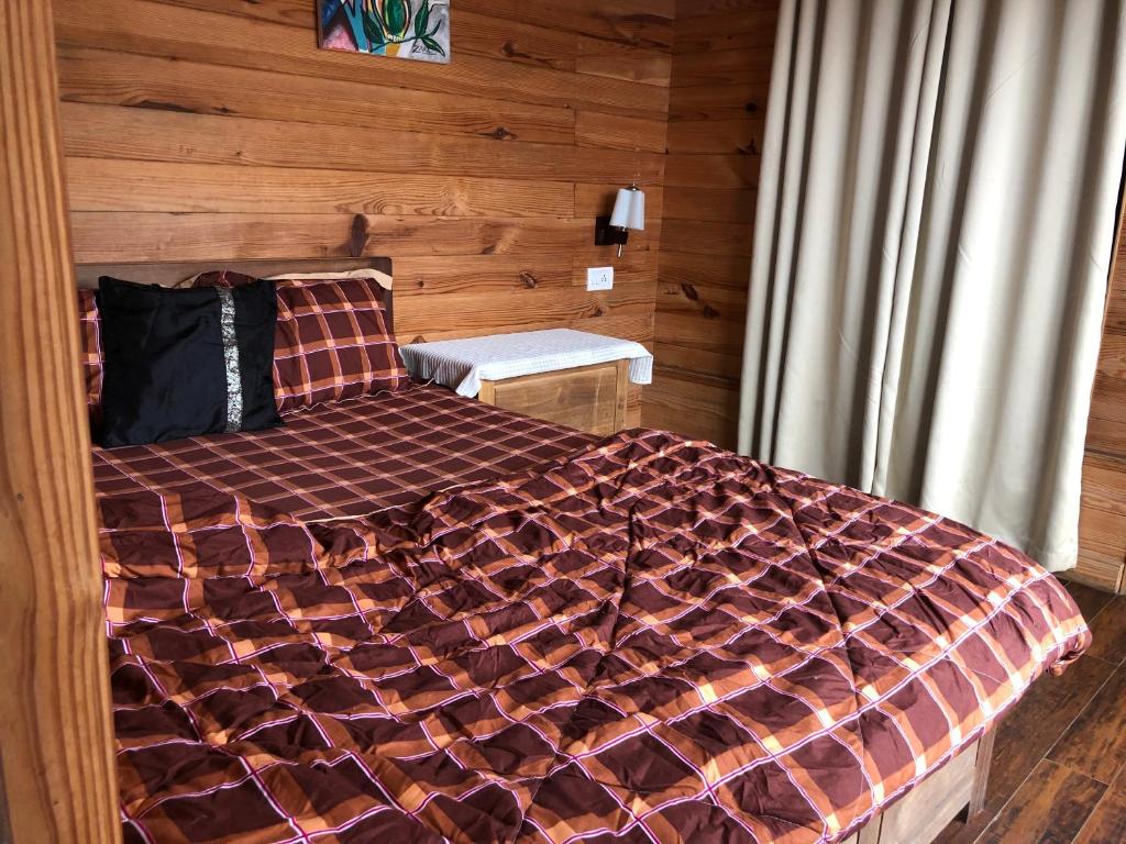 Postel nebo postele na pokoji v ubytování Ngawang homestay