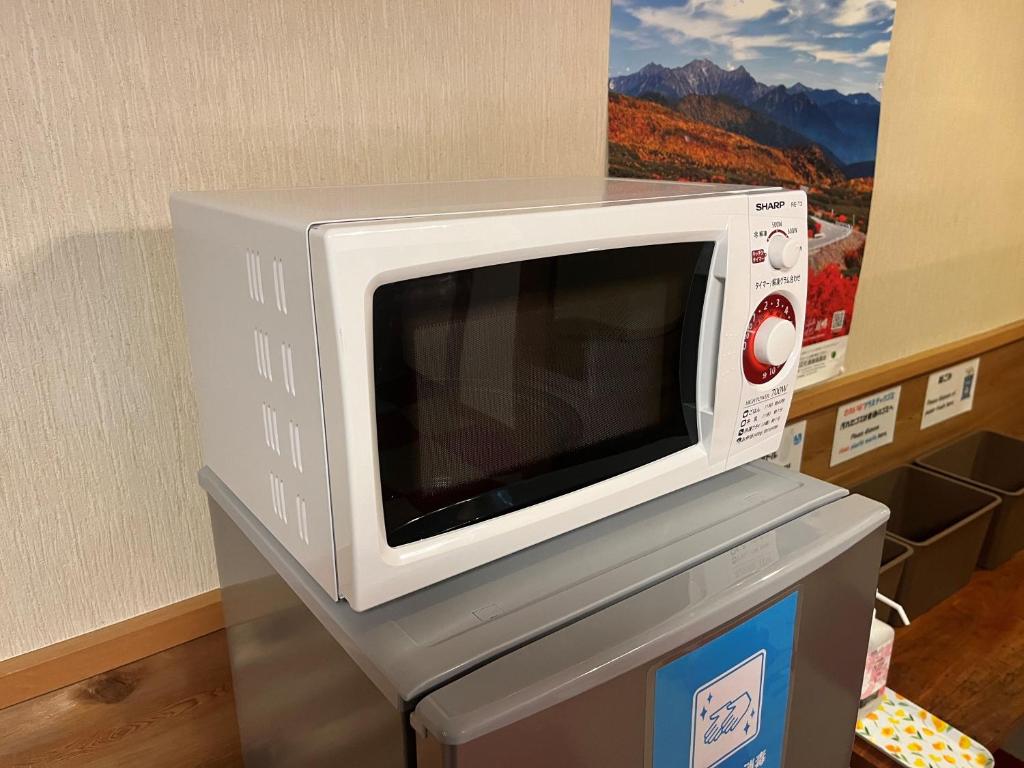 TV a/nebo společenská místnost v ubytování 雀の宿 やぐら