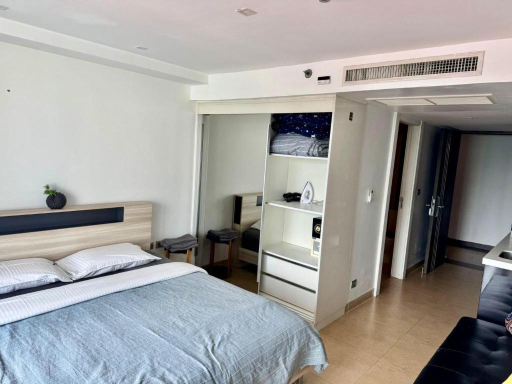 Postel nebo postele na pokoji v ubytování Centara Pattaya Apartment