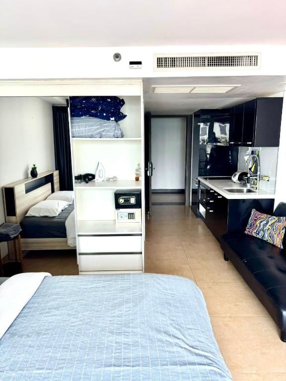 Kuchyň nebo kuchyňský kout v ubytování Centara Pattaya Apartment
