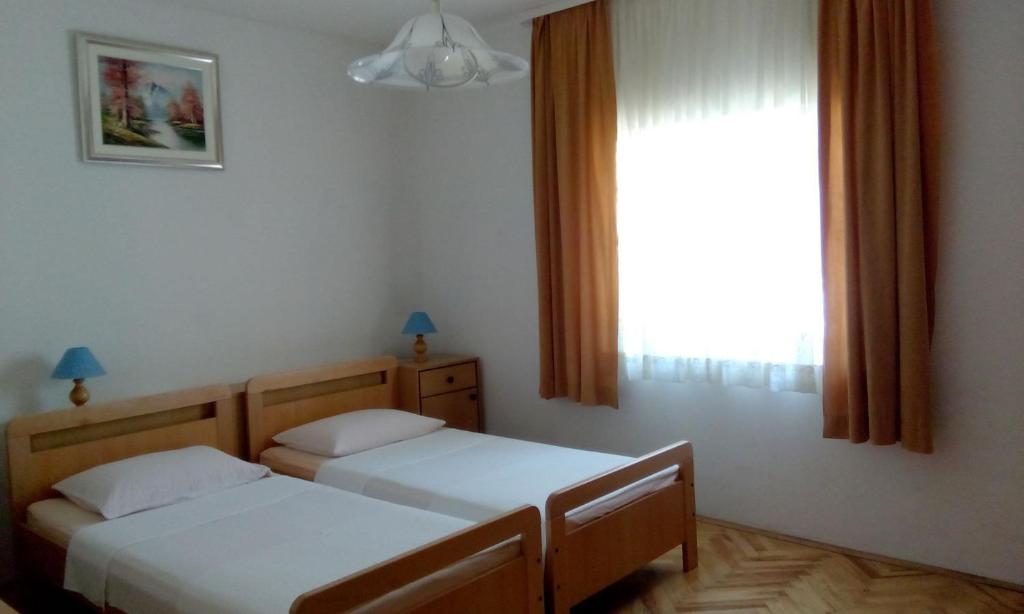 Posteľ alebo postele v izbe v ubytovaní Apartment Miki