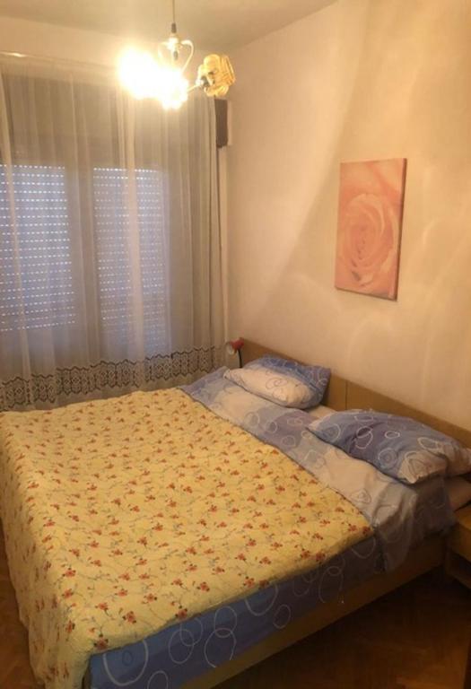 Łóżko lub łóżka w pokoju w obiekcie Apartments Denko