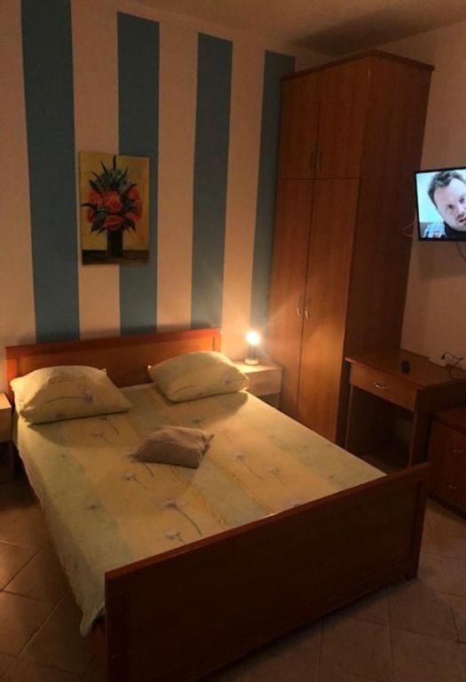 Łóżko lub łóżka w pokoju w obiekcie Apartments Denko