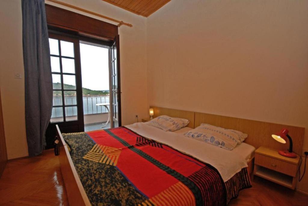Łóżko lub łóżka w pokoju w obiekcie Apartments Denko