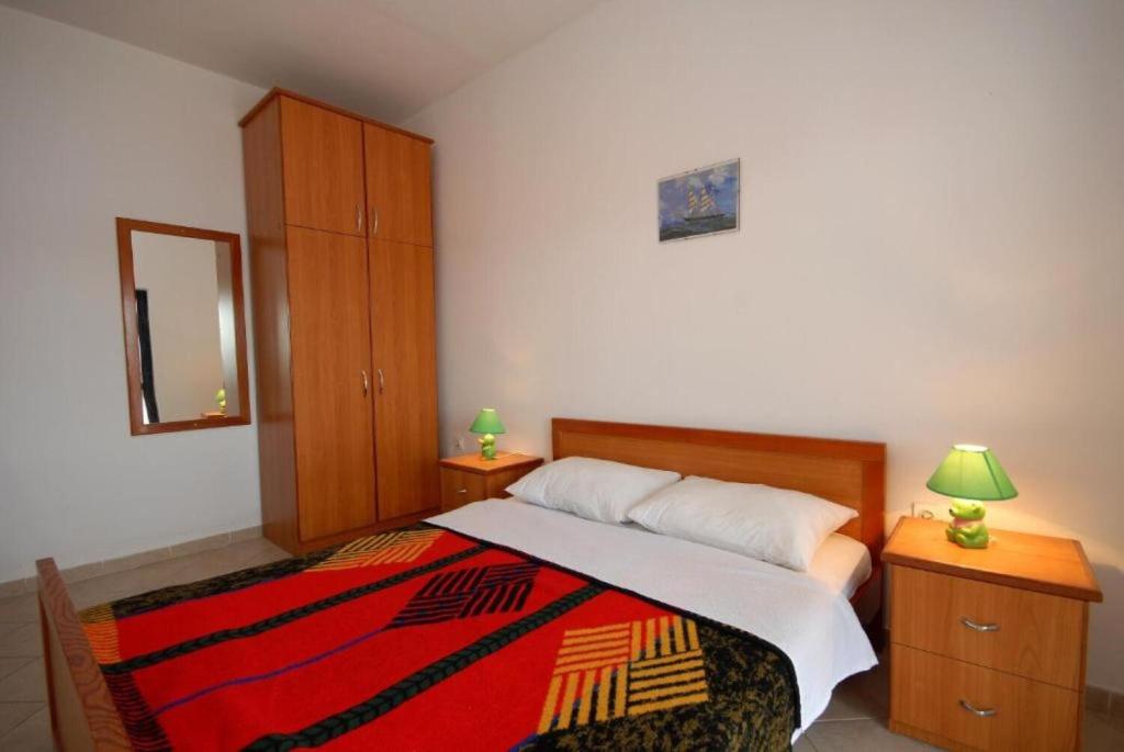 Łóżko lub łóżka w pokoju w obiekcie Apartments Denko