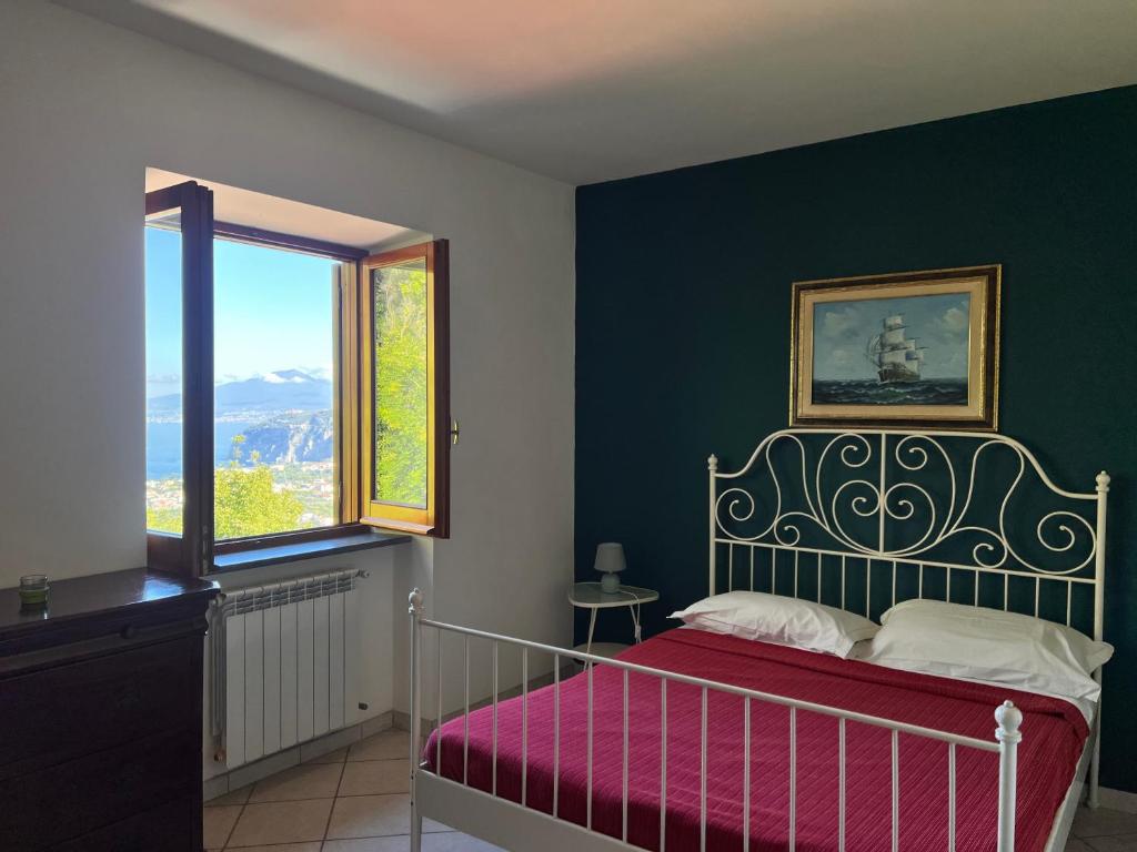 Postel nebo postele na pokoji v ubytování B&b L' Arancio in fiore