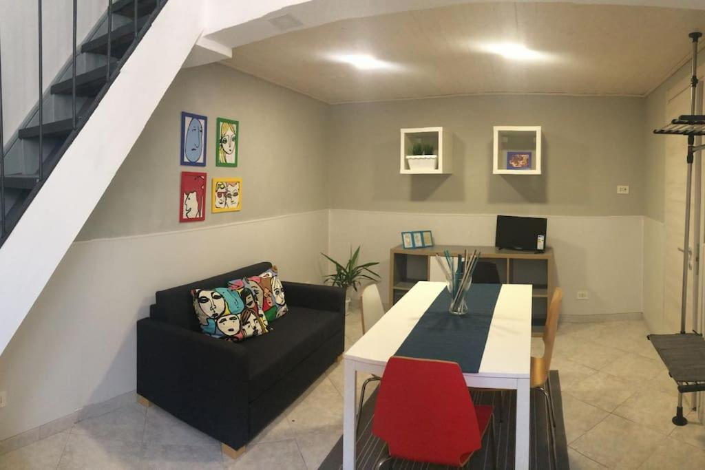 a living room with a couch and a table at La casa al teatro in Catania