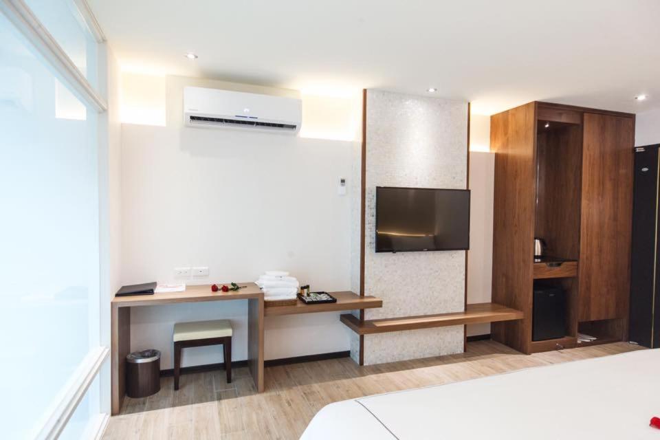 Postel nebo postele na pokoji v ubytování Da Pu Hotspring Hotel