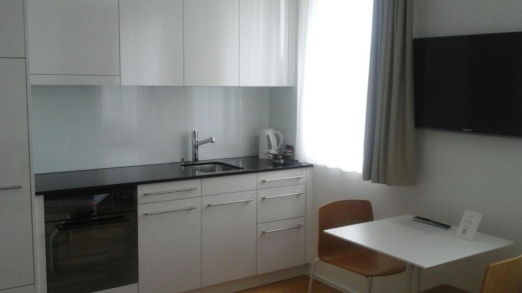 Kuchyň nebo kuchyňský kout v ubytování Hotel Flawil