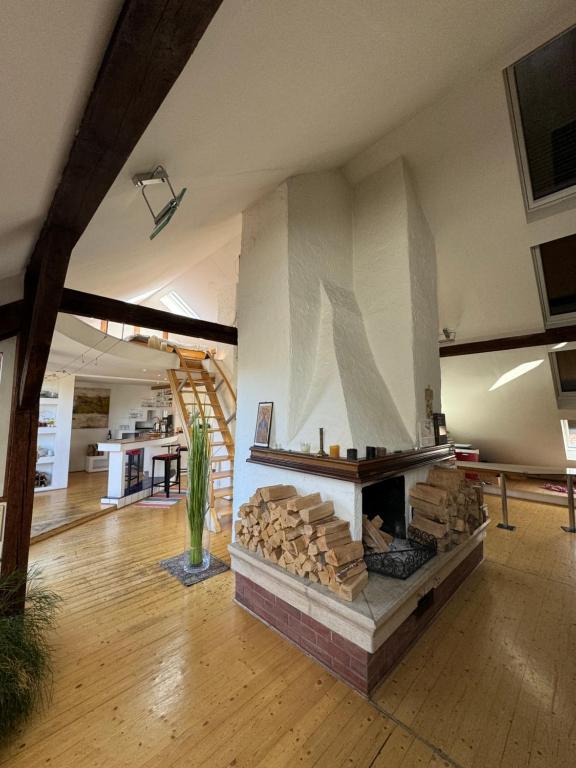a large room with a fire place in a building at Artistic Romantic Central Loft I Self Checkin in Graz