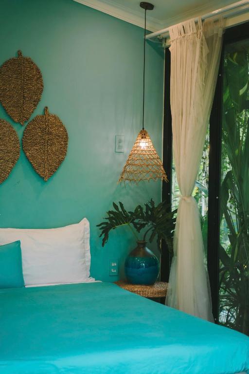 Postel nebo postele na pokoji v ubytování Bến Đò Xưa Homestay & Coffee