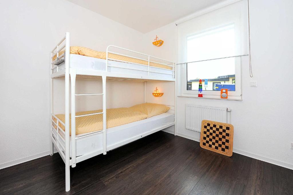 Postel nebo postele na pokoji v ubytování Haus Kunterbunt