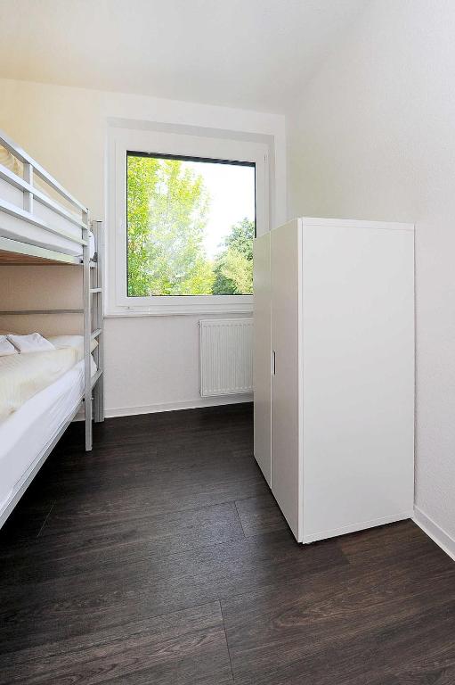Postel nebo postele na pokoji v ubytování Haus Kunterbunt