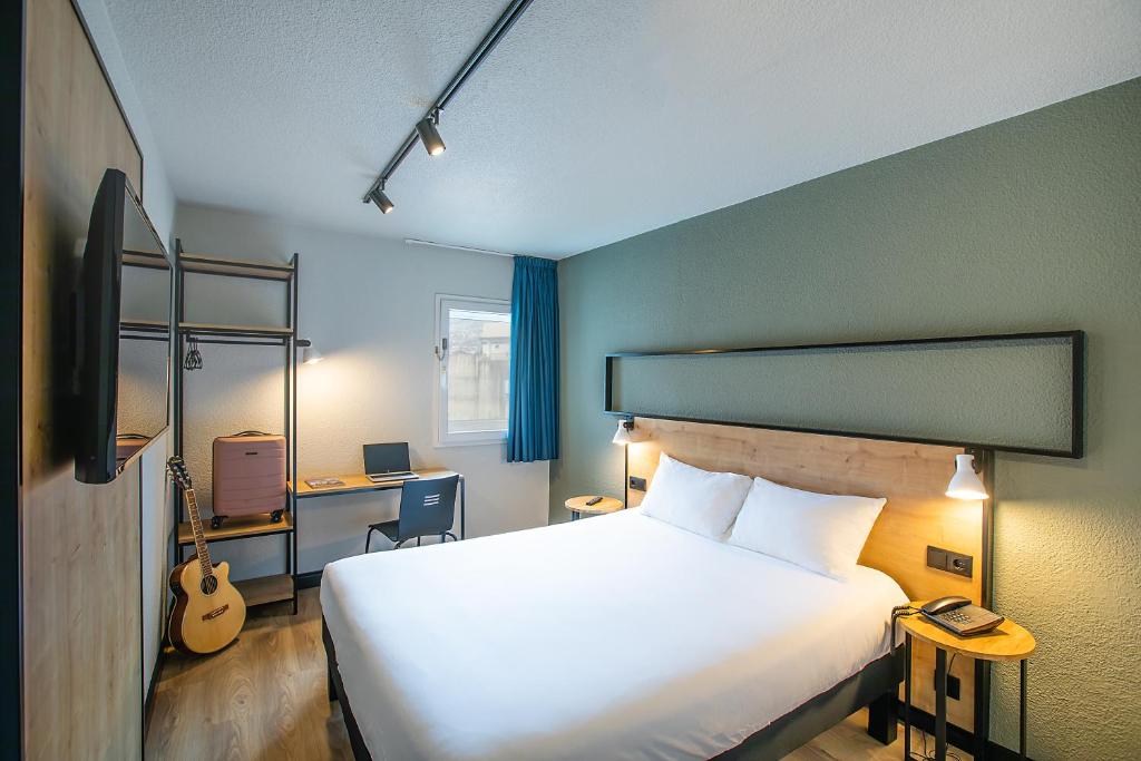 Postel nebo postele na pokoji v ubytování Hotel ibis Guimaraes