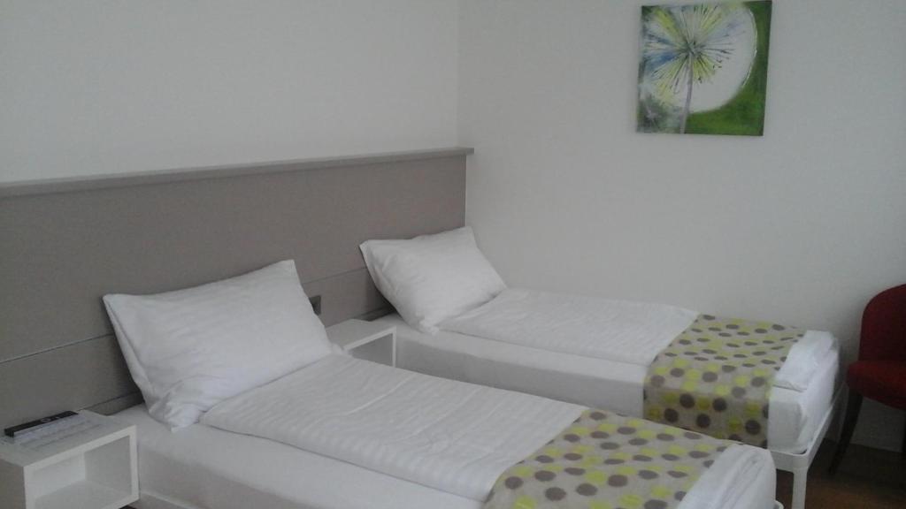 Postel nebo postele na pokoji v ubytování Hotel Flawil