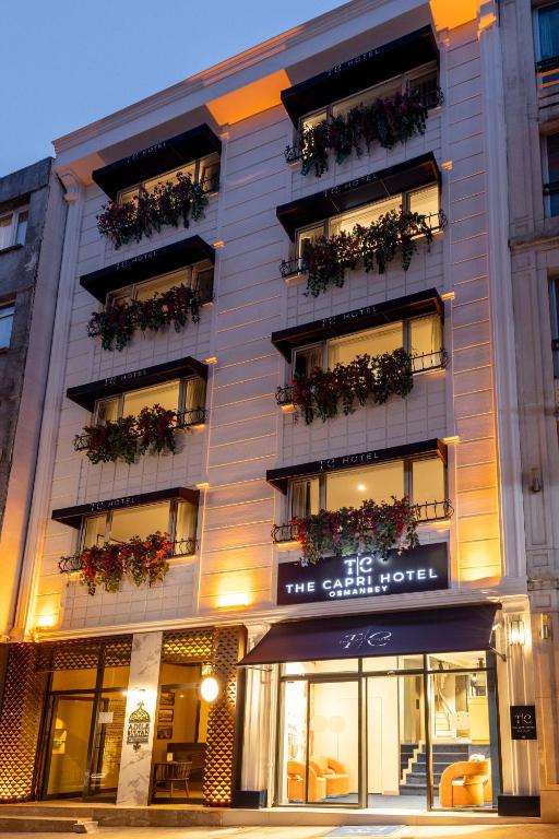 a building with flower boxes on the balconies of it at The Capri Hotel Osmanbey in Istanbul
