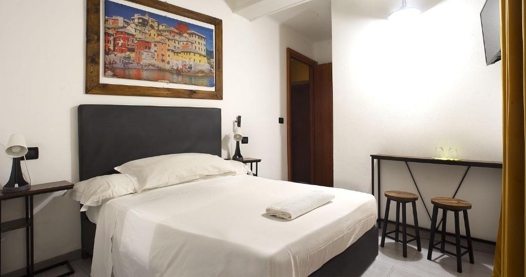 Postel nebo postele na pokoji v ubytování Red and Blues Music Hotel Genova