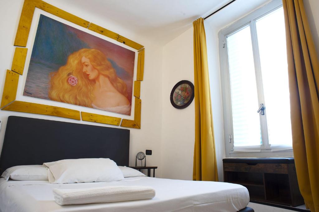 Postel nebo postele na pokoji v ubytování Red and Blues Music Hotel Genova