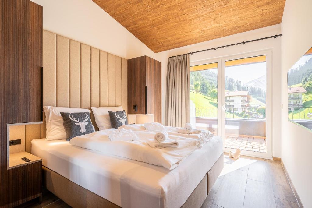 Postel nebo postele na pokoji v ubytování Alpenzauber Apartments by Monteviva