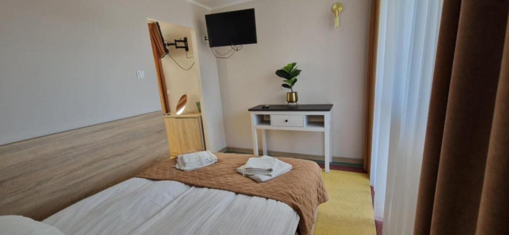 Postel nebo postele na pokoji v ubytování Sanatorium Fala
