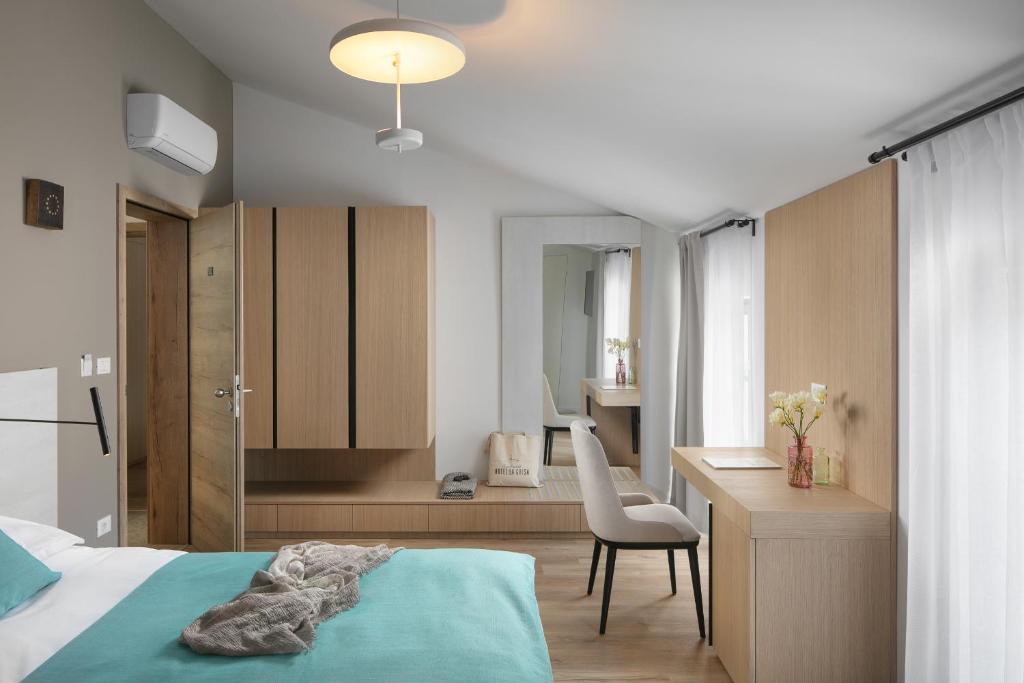 Posteľ alebo postele v izbe v ubytovaní Hotel La Grisa