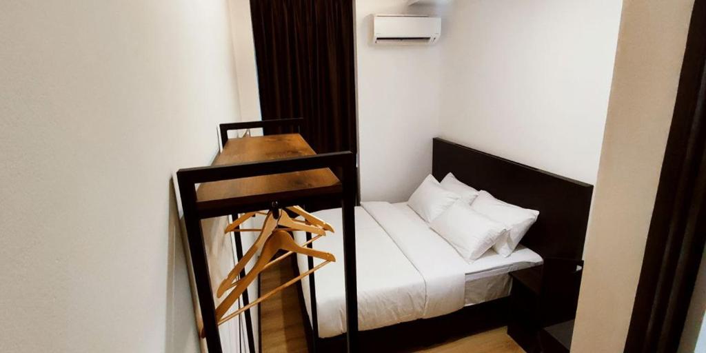 Postel nebo postele na pokoji v ubytování ABA Hotel Kuching Sarawak